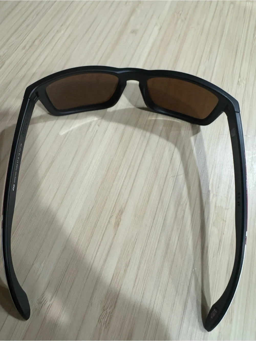 Oakley Black Sunglasses with Red Stripe and Gold Hardware